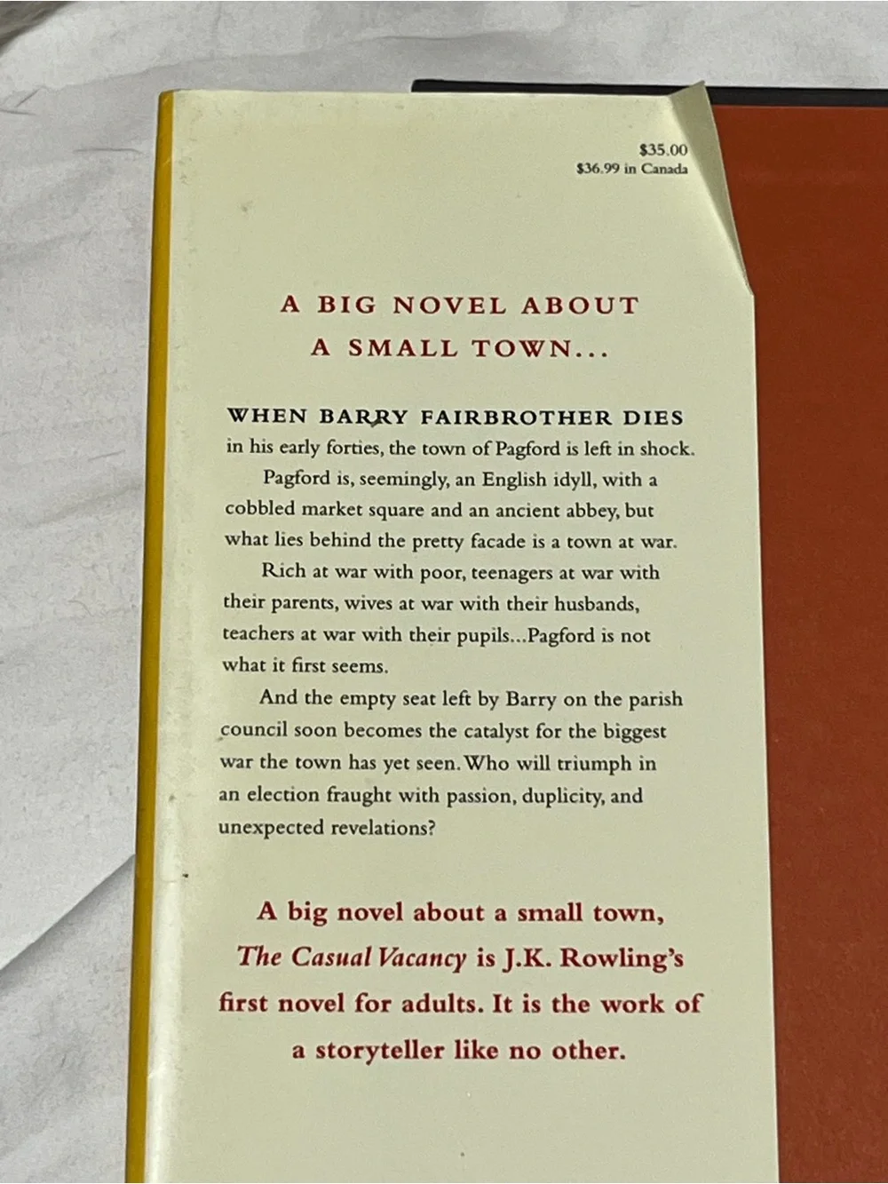 J.K. Rowling “The Casual Vacancy” Book - Hard Cover Red & Yellow